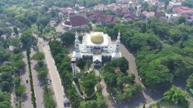 4K footage aerial view of the Baitul Faidzin Grand Mosque at noon in the middle of the central government administration.