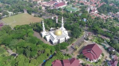 4K footage aerial view of the Baitul Faidzin Grand Mosque at noon in the middle of the central government administration.