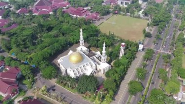 4K footage aerial view of the Baitul Faidzin Grand Mosque at noon in the middle of the central government administration.