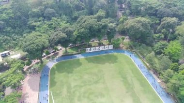 Bogor, Indonesia - October 22 2022. 4K footage aerial view of Sempur field park which many people use for exercise.