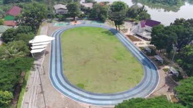 aerial view of a green open space called alun-alun Cirimekar for sports or community activities in open spaces.