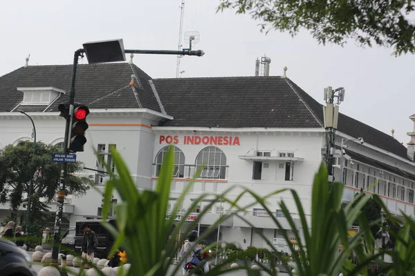 stock image Yogyakarta, Indonesia - March, 19 2023. historic building which serves as the Indonesia Post office located in Yogyakarta, Indonesia. Foreground.