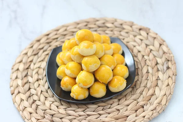 nastar cookies, pineapple tarts or nanas tart are small, bite-size pastries filled or topped with pineapple jam, commonly found when Hari Raya or Eid Al Fitr or Lebaran. Selected focus