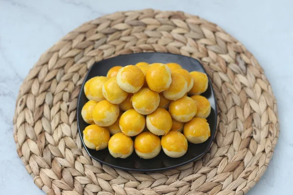 nastar cookies, pineapple tarts or nanas tart are small, bite-size pastries filled or topped with pineapple jam, commonly found when Hari Raya or Eid Al Fitr or Lebaran. Selected focus