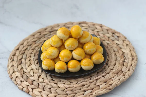 nastar cookies, pineapple tarts or nanas tart are small, bite-size pastries filled or topped with pineapple jam, commonly found when Hari Raya or Eid Al Fitr or Lebaran. Selected focus
