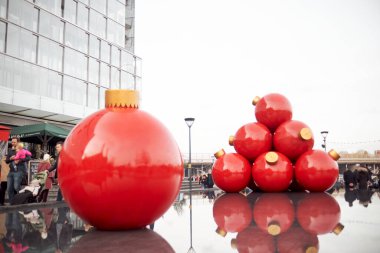 red and white christmas ball on a background of snow