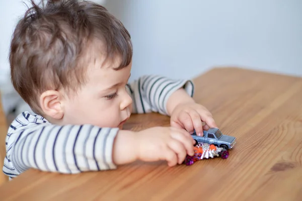 stock image Little boy plaing with his toy cars