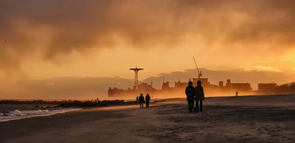 Sudden sand storm on the beach at Coney Island at Sunset during the pandemic