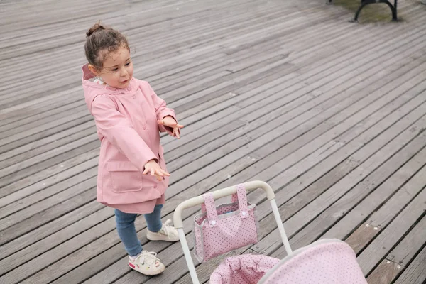 Young Girl Playing Her Toy Stroller Boardwalk — Stock Photo, Image