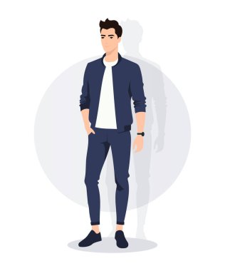 İyi giyimli lacivert takım elbiseli genç bir adam gündelik beyaz spor ayakkabılarla eşleştirilmiş, modern bir moda anlayışını temsil ediyor. Kendine güveni onu zarif bir model haline getiriyor.