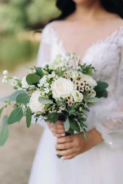 Young Girl White Wedding Dress Holds Her Hands Bouquet Flowers — Fotografia de Stock