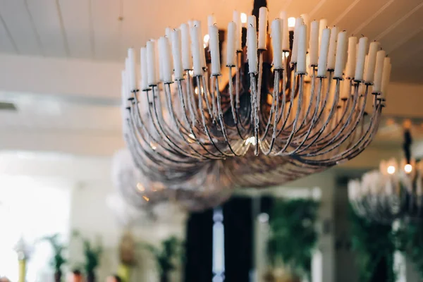 stock image Standing brass chandelier with burning candles in shallow focus home setting. High quality photo