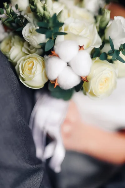 Closeup of a floral corsage on the arm of a high school girl attending her graduation. High quality photo