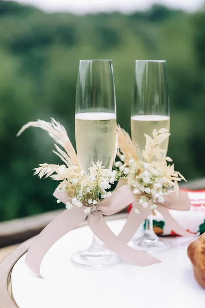 wedding glasses with sparkling wine . High quality photo