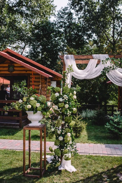 wedding moment, decorations, decor, wedding decorations, flowers, chairs, outdoor ceremony in the open air, bouquets of flowers. High quality photo