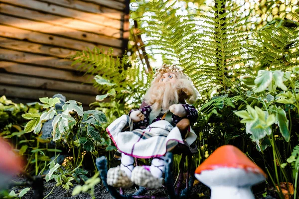 stock image handmade gnome sitting in the garden. High quality photo