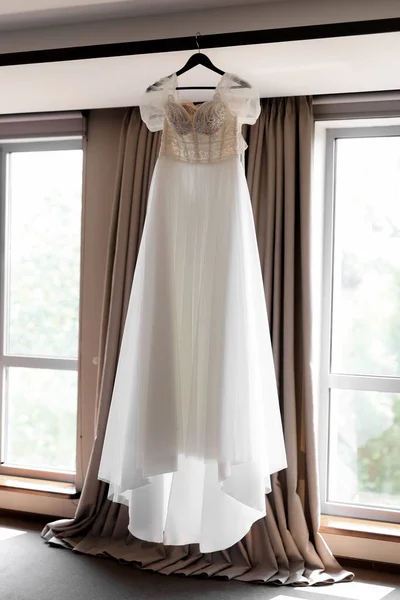 stock image light and elegant bride's dress on a mannequin in a chic luxury interior. High quality photo