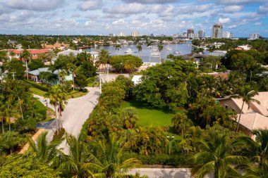 Aerial drone view of Harbor Beach neighborhood in Fort Lauderdale, Sylvia lake with boats, yachts, luxury houses of different styles luxurious and expensive, blue sky clipart