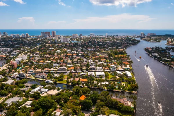 stock image Aerial drone shot of luxury neighborhood in miami with bay with boats sailing, ocean and blue sky, cityscape in the background