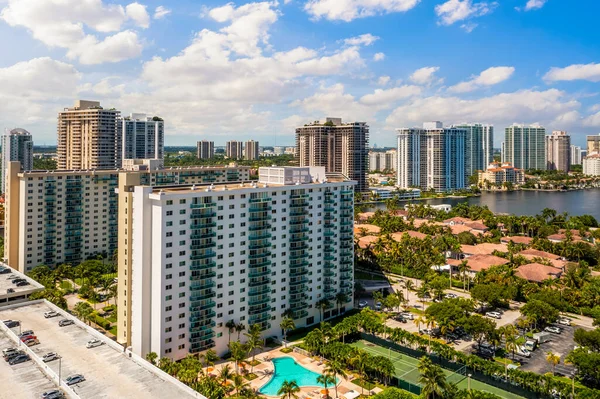 stock image Aerial drone view on the city Sunny isles beach, buildings with apartments, houses, towers, view of the sea, and bay canal, tropical vegetation and blue sky