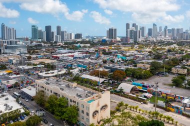 Aerial drone shot of artistic area in Wynwood, Miami, intervened buildings, colorful, modern towers and condos, blue sky, clipart