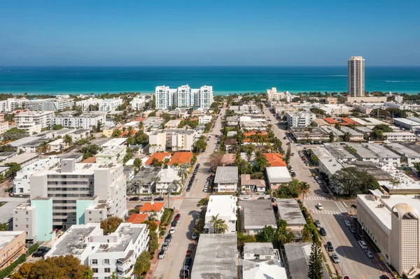 Aerial drone view of the North Beach neighborhood in Miami Beach, streets, white buildings, towers, cars, blue sky, urban area, urban skyline