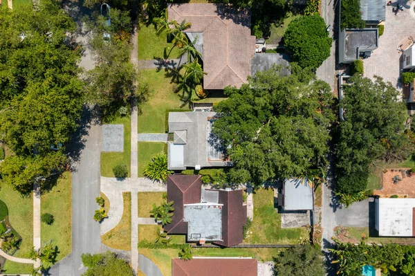 stock image Aerial drone shot of suburb in Miami Shore village, Miami Dade County, with large tropical vegetation around, modern houses with elegance and style, summer weather, blue sky