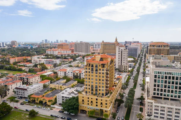 stock image Beautiful panoramic view taken with drone of coral gables city, suburbs area, buildings and towers, with lots of trees around, blue sky, summer weather, golden colors of the sun at sunset