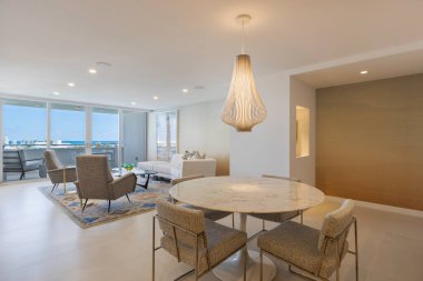 Beautiful photos of the interior of a Apartment. Luxurious, modern living room with cozy furniture and elegant architecture.