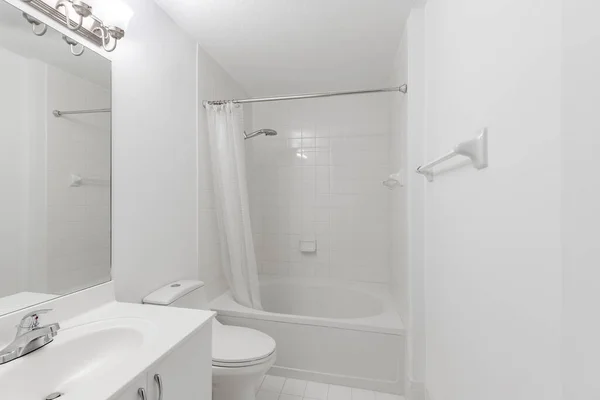 Beautiful Shot Footage located in Florida, USA. Clean, modern bathroom with refreshing shower, reflecting mirror, and sleek tiles.