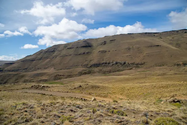 Patagonian mountains landscape and blue sky.