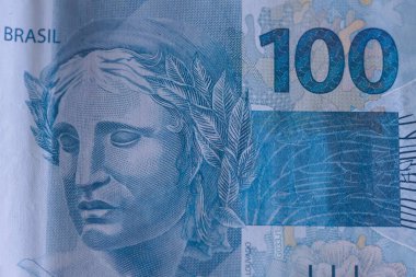 Gerçek (BRL) banknot, Brezilya parası. Para, Reais, Brezilya Real, Brezilya. 100 reais 'lik banknotu kapat. 100 reais banknotun Macro fotoğrafı.