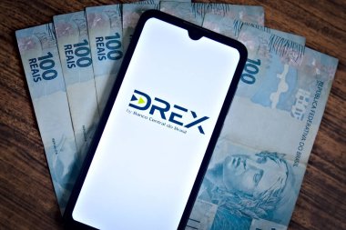 The Digital Real X (Drex) logo is displayed on a smartphone screen. It is a Brazilian digital currency, to be used as the digital version of the Brazilian real. DREX. Rio de Janeiro, Brazil-01.05.2024. clipart