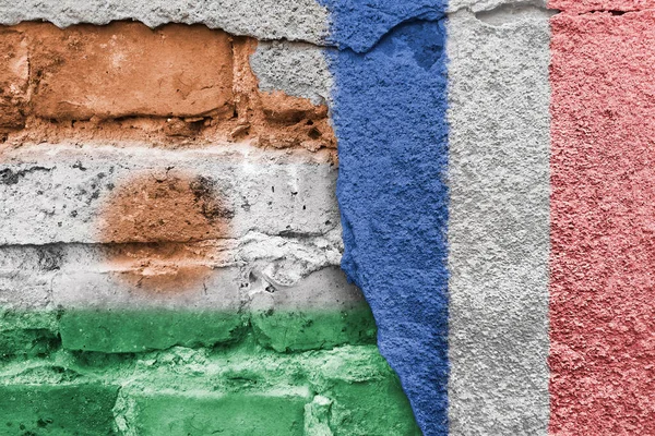 stock image Flags of countries on background of brick wall. Street art. Diplomacy and international relations. Embassy and consulate.