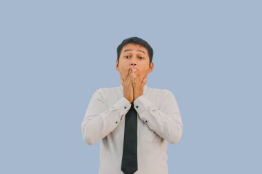 Adult Asian man showing shocked expression with his hands covering mouth clipart