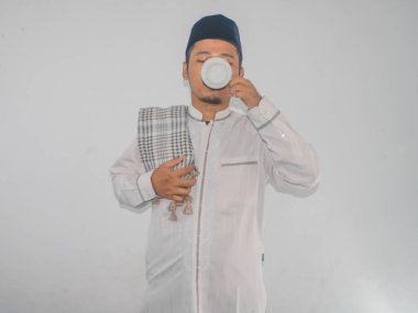 Moslem Asian man drinking a water clipart