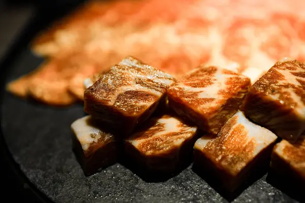 stock image meticulously cut and well-arranged beef with premium marbling alongside fresh green herbs