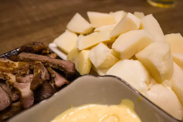 stock image  freshly sliced bamboo shoots accompanied by a yellow dressing