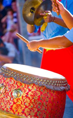 a drummer at a temple festival clipart