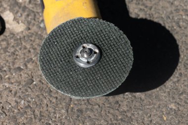 An electric blue grinder with handheld rubber grip with cable, use to cut-off or grinding the job ind building or outdoor, clipping path. Front view. High quality photo