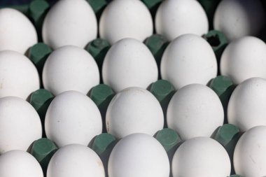 Close-up of many white eggs background. High quality photo