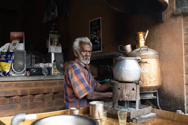 stock image  Tamil Nadu, India - 01-15-2023 - Local man preparing masala chai on the street . High quality photo