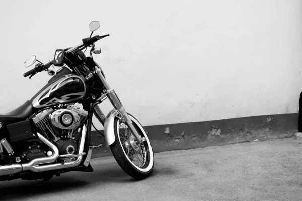 stock image Sweden, Stockholm - MAY 2022: Vintage chopper bike stays parked near brick wall in Stockholm city in Sweden. High quality photo