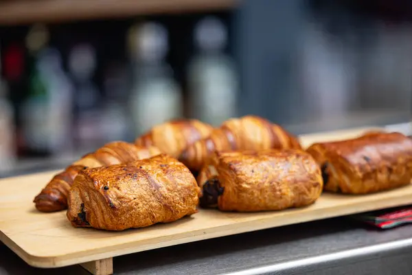 stock image Fresh croissants on a cutting board close-up. French cuisine concept. High quality photo