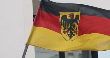 Flag of Germany with eagle waving in the wind - highly detailed fabric texture . High quality 4k footage