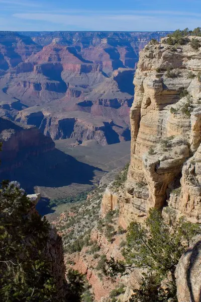 stock image View of the Grand Cnyon, Arizona, with a rock formation in the foreground.