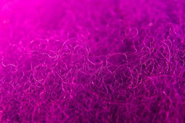 Closeup of purple dyed Targhee wool. clipart