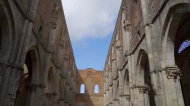 View of the Abbey of San Galgano, in Tuscany, Italy. Italian Tuscan holidays. Crete Senesi, Val d'Orcia, Tuscan hills, Italian wine.