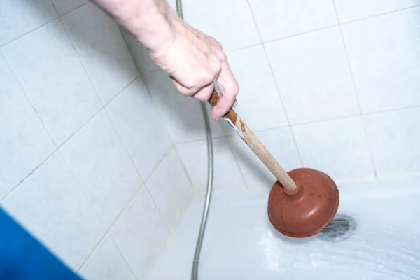 Person Cleans Shower Drain Clogged Sink Plunger Pipes Clogged Waste Fotos de stock