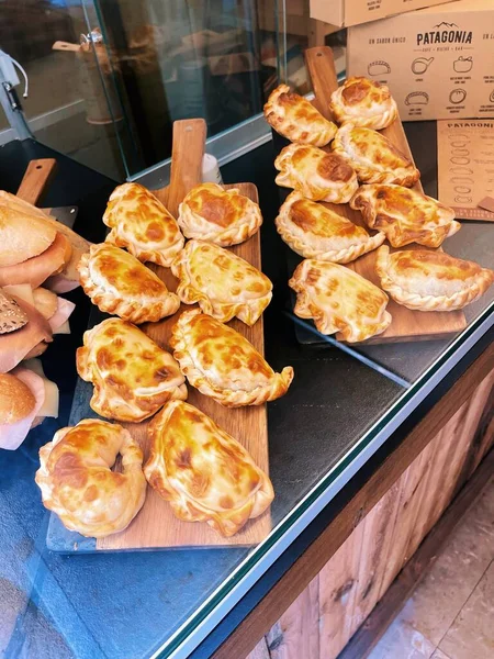delicious baked pastry rolls in a market stall